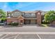Charming townhome with attached two-car garages and well maintained landscaping at 9637 E 5Th Ave # 101, Denver, CO 80230