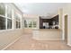 Well-lit kitchen seamlessly connects to the living space with large windows at 9637 E 5Th Ave # 101, Denver, CO 80230