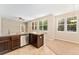 Bright kitchen with stainless steel dishwasher, tile flooring, and breakfast nook at 9637 E 5Th Ave # 101, Denver, CO 80230