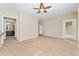 Open living area leading to a bathroom and a patio with abundant sunlight at 9637 E 5Th Ave # 101, Denver, CO 80230
