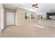 Inviting living room with large windows, seamlessly connecting to the kitchen area at 9637 E 5Th Ave # 101, Denver, CO 80230