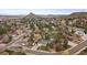 Expansive aerial view of a residential area surrounded by lush greenery and mountains in the background at 31 Circle Dr, Castle Rock, CO 80104