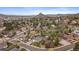 Expansive aerial view of a residential area surrounded by lush greenery and mountains in the background at 31 Circle Dr, Castle Rock, CO 80104