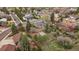 Aerial view of a home with large backyard, deck, fire pit, and mature trees at 31 Circle Dr, Castle Rock, CO 80104