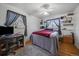 Comfortable bedroom with hardwood floors, large windows, and space for a desk at 31 Circle Dr, Castle Rock, CO 80104