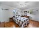 Bright bedroom with hardwood floors, a ceiling fan, and a large window offers natural light at 31 Circle Dr, Castle Rock, CO 80104