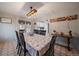 Inviting dining area adjacent to the kitchen featuring a large window and modern lighting fixture at 31 Circle Dr, Castle Rock, CO 80104