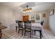 Dining room with floral tablecloth, black wooden chairs and an industrial-style chandelier at 31 Circle Dr, Castle Rock, CO 80104