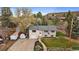 Aerial view of a split-level home with a trailer, shed, and well-maintained lawn and landscaping at 31 Circle Dr, Castle Rock, CO 80104