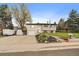 Charming split-level home features a well-manicured lawn, flower beds, and an attached one-car garage at 31 Circle Dr, Castle Rock, CO 80104