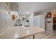 Bright kitchen with white cabinets, modern appliances, and ample counter space, adjacent to dining area at 31 Circle Dr, Castle Rock, CO 80104