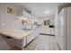 Bright kitchen with white cabinets and white appliances, and an eat-in countertop, perfect for casual dining at 31 Circle Dr, Castle Rock, CO 80104