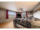 Cozy living room with hardwood floors, large windows, and comfortable sectional seating at 31 Circle Dr, Castle Rock, CO 80104