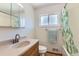 This bathroom features a shower-tub combination with a shower curtain and vanity sink at 10684 Downing St, Northglenn, CO 80233