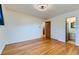 This bright bedroom boasts hardwood floors and large closet at 10684 Downing St, Northglenn, CO 80233