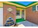 Close-up of the home's entryway with a unique water fountain and security door at 10684 Downing St, Northglenn, CO 80233