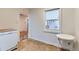 Cozy kitchen area featuring tile flooring and bright natural lighting at 10684 Downing St, Northglenn, CO 80233