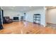 Spacious living room with a fireplace, hardwood floors and ample natural light at 10684 Downing St, Northglenn, CO 80233