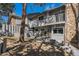 Charming home featuring a cozy patio, ideal for entertaining, and a stone accent wall for a rustic touch at 2308 Hearth Dr # 37, Evergreen, CO 80439