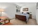 Simple bedroom with a cozy bed, classic decor, and lots of natural light through the window at 2308 Hearth Dr # 37, Evergreen, CO 80439