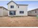 Modern two-story home showcasing the backyard, ready for landscaping and personalization at 45940 Gentry Ave, Bennett, CO 80102