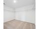 Walk-in closet with carpeted flooring and wire shelving at 45940 Gentry Ave, Bennett, CO 80102