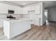 A white kitchen featuring stainless steel appliances and plenty of counter space at 45940 Gentry Ave, Bennett, CO 80102