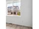 Bright interior view of a window overlooking a neighboring house at 45940 Gentry Ave, Bennett, CO 80102