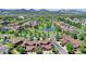Picturesque aerial view of the community, showcasing a pond, green spaces, and well-maintained homes at 5887 S Taft Ln, Littleton, CO 80127
