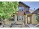 Charming home featuring detailed trim, neutral colors and lovely landscaping, creating a welcoming curb appeal at 5887 S Taft Ln, Littleton, CO 80127