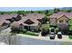 Exterior view of a charming townhome with manicured landscaping, and a ramp for accessibility at 5887 S Taft Ln, Littleton, CO 80127