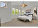 Bright main bedroom featuring high ceilings, a fan, and ample natural light at 5887 S Taft Ln, Littleton, CO 80127