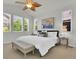 Bright main bedroom featuring high ceilings, a fan, and ample natural light at 5887 S Taft Ln, Littleton, CO 80127