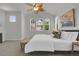 Large main bedroom with high ceilings, neutral carpet and bench seat at 5887 S Taft Ln, Littleton, CO 80127