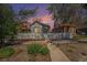 Charming home featuring a white picket fence, lush greenery, and a welcoming walkway at 3042 N Franklin St, Denver, CO 80205