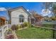 Beautiful home with lush green lawn and charming curb appeal at 3042 N Franklin St, Denver, CO 80205