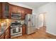 Well-equipped kitchen featuring stainless appliances and ample cabinet space for efficient meal preparation at 3042 N Franklin St, Denver, CO 80205