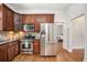 Well-equipped kitchen featuring stainless appliances and a convenient layout with seamless access to the adjacent rooms at 3042 N Franklin St, Denver, CO 80205