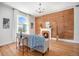 Inviting living room with hardwood floors, exposed brick wall, and cozy fireplace at 3042 N Franklin St, Denver, CO 80205