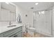 Updated bathroom with a glass-enclosed shower, white subway tile, and updated fixtures at 13438 W 23Rd Pl, Golden, CO 80401