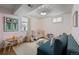 A playroom/bedroom with playful wallpaper and an abundance of natural light at 13438 W 23Rd Pl, Golden, CO 80401