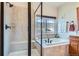 Large bathroom with walk-in shower and soaking tub at 6516 Umber Cir, Arvada, CO 80007