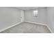Carpeted basement bedroom with window, offering a quiet and private space at 3200 Locust St, Denver, CO 80207