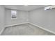 Basement bedroom with natural light; carpeted for comfort with neutral paint and window at 3200 Locust St, Denver, CO 80207