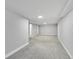 Large, open basement space with neutral carpet and paint, ready for customization and enjoyment at 3200 Locust St, Denver, CO 80207