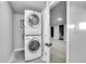 Laundry room area with stacked washer and dryer, offering space-saving convenience at 3200 Locust St, Denver, CO 80207