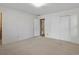 Neutral bedroom featuring carpet, an overhead light, and decorative wallpaper at 2433 S Oneida St, Denver, CO 80224