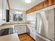 Updated kitchen featuring stainless steel appliances and white countertops at 2433 S Oneida St, Denver, CO 80224