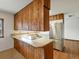 The kitchen offers a cooktop island, stainless steel appliances, and a dishwasher at 2433 S Oneida St, Denver, CO 80224