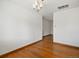 An empty living room with hardwood flooring, white walls, and natural light at 2433 S Oneida St, Denver, CO 80224